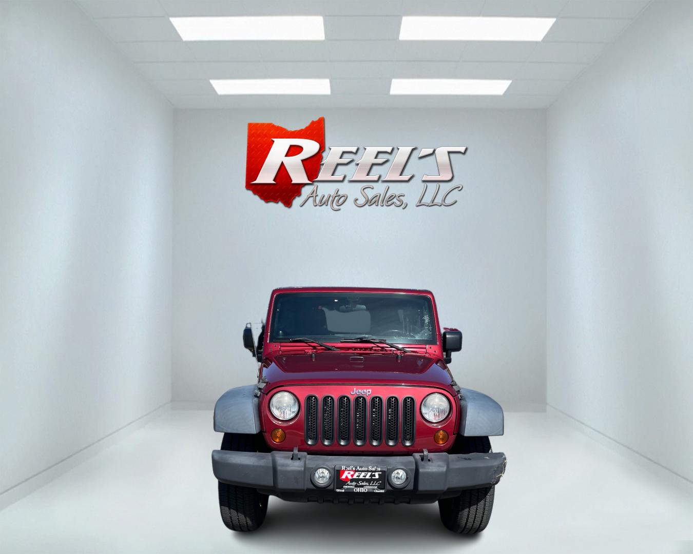 2012 Red /Black Jeep Wrangler Unlimited Sport 4WD (1C4BJWDG3CL) with an 3.6L V6 DOHC 24V engine, 5-Speed Automatic transmission, located at 547 E. Main St., Orwell, OH, 44076, (440) 437-5893, 41.535435, -80.847855 - This 2012 Jeep Wrangler Unlimited Sport with 4WD features a robust 3.6-liter Pentastar V6 engine paired with a 5-speed automatic transmission. It is equipped with a Dana 44 rear axle and a Dana 30 front axle, ensuring durable and reliable off-road capabilities. The model comes with a hardtop convert - Photo#1